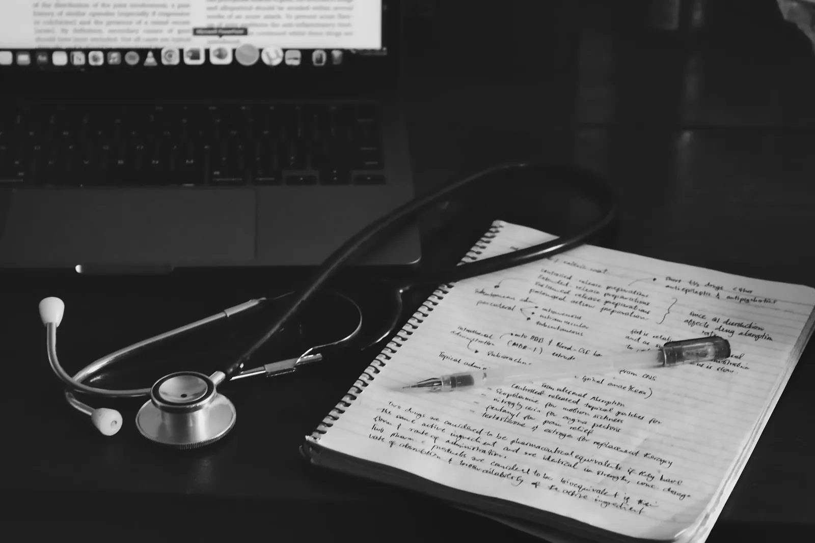 A handwritten clinical note beside a stethoscope